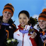 Women's 1,000-meter speedskating medalists, from left, Margot Boer of the Netherlands, bronze, Zang Hong of China, gold, and Ireen Wust of the Netherlands, silver, pose with their medals at the 2014 Winter Olympics in Sochi, Russia, Friday, Feb. 14, 2014. (AP Photo/David J. Phillip)