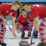 Norway's skip Thomas Ulsrud, center, shouts to his sweepers Haavard Vad Petersson, left, and Christoffer Svae after delivering the rock during the men's curling competition against Sweden at the 2014 Winter Olympics, Thursday, Feb. 13, 2014, in Sochi, Russia. (AP Photo/Robert F. Bukaty)