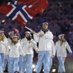 Aksel Lund Svindal of Norway carries the national flag as he leads his team into the stadium the stadium during the opening ceremony of the 2014 Winter Olympics in Sochi, Russia, Friday, Feb. 7, 2014. (AP Photo/Patrick Semansky