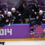 Team USA jumps out of the box after USA forward T.J. Oshie scored the winning goal against Russia in a shootout of overtime of a men's ice hockey game at the 2014 Winter Olympics, Saturday, Feb. 15, 2014, in Sochi, Russia. (AP Photo/Petr David Josek)