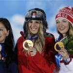 Women's snowboard parallel giant slalom medalists, from left, Japan's Tomoka Takeuchi, silver, Switzerland's Patrizia Kummer, gold, and Russia's Alena Zavarzina, bronze, pose with their medals at the 2014 Winter Olympics in Sochi, Russia, Wednesday, Feb. 19, 2014. (AP Photo/Morry Gash)