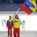 Antonio Pardo of Venezuela carries the national flag as he leads the team during the opening ceremony of the 2014 Winter Olympics in Sochi, Russia, Friday, Feb. 7, 2014. (AP Photo/Mark Humphrey)