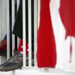A Canadian skating flag wears socks with maple leaves printed on it during the women's 1,000-meter speedskating race at the Adler Arena Skating Center during the 2014 Winter Olympics in Sochi, Russia, Thursday, Feb. 13, 2014. (AP Photo/Pavel Golovkin)