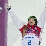 Canada's Justine Dufour-Lapointe celebrates on the podum after winning the gold medal in the women's moguls freestyle skiing event at the Rosa Khutor Extreme Park, at the 2014 Sochi Winter Olympics, Saturday, Feb. 8, 2014, in Krasnaya Polyana, Russia. (AP Photo/The Canadian Press, Adrian Wyld)