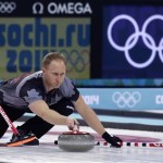 Canada's skip Brad Jacobs delivers the rock during the men's curling gold medal game against Britain at the 2014 Winter Olympics, Friday, Feb. 21, 2014, in Sochi, Russia. (AP Photo/Robert F. Bukaty)