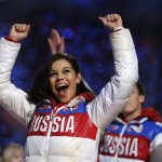 Russian figure skater Adelina Sotnikova waves to spectators during the closing ceremony of the 2014 Winter Olympics, Sunday, Feb. 23, 2014, in Sochi, Russia. (AP Photo/Darron Cummings)