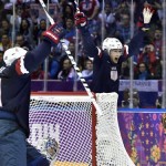United States forwards Phil Kessel, left, and James van Riemsdyk, right, celebrate Cam Fowler's goal against Russia during second period preliminary round hockey action at the 2014 Sochi Winter Olympics in Sochi, Russia on Saturday, Feb. 15, 2014. (AP Photo/The Canadian Press, Nathan Denette)
