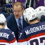 USA head coach Dan Bylsma task to the team during a break in the action in the second period of the men's semifinal ice hockey game against Canada at the 2014 Winter Olympics, Friday, Feb. 21, 2014, in Sochi, Russia. (AP Photo/Matt Slocum)