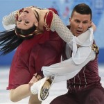 Charlene Guignard, left, and Marco Fabbri, of Italy, perform their free dance in the ice dance portion of the team figure skating event at the Winter Olympics, Sunday, Feb. 9, 2014, in Sochi, Russia. (AP Photo/The Canadian Press, Paul Chiasson)