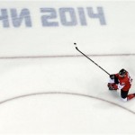 Canada forward Benn Jamie celebrates his goal with teammate Corey Perry during a men's semifinal ice hockey game against USA at the 2014 Winter Olympics, Friday, Feb. 21, 2014, in Sochi, Russia. (AP Photo/David J. Phillip )