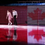 Tessa Virtue and Scott Moir of Canada step onto the ice before their performance for the figure skating exhibition gala at the Iceberg Skating Palace during the 2014 Winter Olympics, Saturday, Feb. 22, 2014, in Sochi, Russia. (AP Photo/Ivan Sekretarev)
