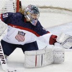 USA goalkeeper Jessie Vetter (31) reaches for the puck during the first period of the women's gold medal ice hockey game against Canada at the 2014 Winter Olympics, Thursday, Feb. 20, 2014, in Sochi, Russia. (AP Photo/Petr David Josek)