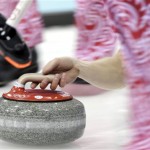 Russia's Evgeny Arkhipov delivers the rock during the men's curling competition against China at the 2014 Winter Olympics, Saturday, Feb. 15, 2014, in Sochi, Russia. (AP Photo/Wong Maye-E)