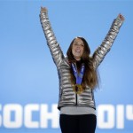 Maddie Bowman of the United States, the gold medalist in the women's ski halfpipe, celebrates during the medals ceremony at the 2014 Winter Olympics, Friday, Feb. 21, 2014, in Sochi, Russia. (AP Photo/David Goldman)