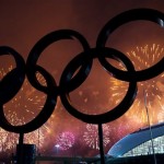 The Olympic Rings are silhouetted as fireworks light up the sky during the closing ceremonies at the 2014 Sochi Winter Olympics on Sunday, Feb. 23, 2014, in Sochi, Russia. (AP Photo/The Canadian Press, Nathan Denette)