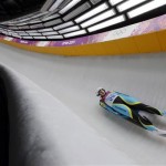 Yelizaveta Axenova of Kazakhstan speeds down the track during the women's singles luge competition at the 2014 Winter Olympics, Monday, Feb. 10, 2014, in Krasnaya Polyana, Russia. (AP Photo/Natacha Pisarenko)