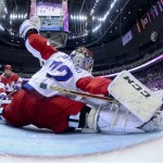 Russia goaltender Sergei Bobrovski blocks a shot by Finland in the third period of a men's ice hockey game at the 2014 Winter Olympics, Wednesday, Feb. 19, 2014, in Sochi, Russia. Finland won 3-1 to advance to the semifinals. (AP Photo/Martin Rose, Pool)