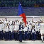 Sarka Strachova of the Czech Republic carries the national flag as she leads the team during the opening ceremony of the 2014 Winter Olympics in Sochi, Russia, Friday, Feb. 7, 2014. (AP Photo/Mark Humphrey)