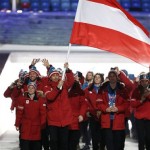 Mario Strecher of Austria carries the national flag as he leads the team during the opening ceremony of the 2014 Winter Olympics in Sochi, Russia, Friday, Feb. 7, 2014. (AP Photo/Mark Humphrey)