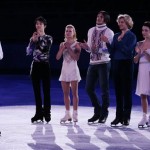 Patrick Chan of Canada, left, speaks on behalf of the skaters during the figure skating exhibition gala at the Iceberg Skating Palace during the 2014 Winter Olympics, Saturday, Feb. 22, 2014, in Sochi, Russia. In back, from right to left, Adelina Sotnikova of Russia, Meryl Davis and Charlie White of the United States, Tatiana Volosozhar and Maxim Trankov of Russia, and Yuzuru Hanyu of Japan. (AP Photo/Ivan Sekretarev)