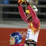 Poland's Kamil Stoch celebrates winning the gold during the ski jumping large hill final at the 2014 Winter Olympics, Saturday, Feb. 15, 2014, in Krasnaya Polyana, Russia. (AP Photo/Gregorio Borgia)