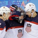 USA defenseman Kevin Shattenkirk, goaltender Jonathan Quick and forward Blake Wheeler celebrate their 5-2 win over the Czech Republic after the men's quarterfinal hockey game in Shayba Arena at the 2014 Winter Olympics, Wednesday, Feb. 19, 2014, in Sochi, Russia. (AP Photo/David J. Phillip )