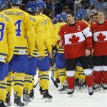 Canada forward Sidney Crosby greets members of team Sweden after Canada won the men's gold medal ice hockey game 3-0 at the 2014 Winter Olympics, Sunday, Feb. 23, 2014, in Sochi, Russia. (AP Photo/Matt Slocum)