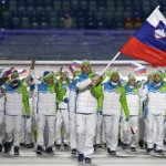 Tomaz Razingar of Slovenia carries the national flag as he leads the team during the opening ceremony of the 2014 Winter Olympics in Sochi, Russia, Friday, Feb. 7, 2014. (AP Photo/Mark Humphrey)