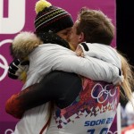 Felix Loch of Germany kisses girlfriend Lisa Ressle after he won the gold medal during the men's singles luge final at the 2014 Winter Olympics, Sunday, Feb. 9, 2014, in Krasnaya Polyana, Russia. (AP Photo/Natacha Pisarenko)