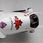 The team from Canada CAN-2, piloted by Chris Spring and brakeman Jesse Lumsden, take a curve during the men's two-man bobsled competition at the 2014 Winter Olympics, Sunday, Feb. 16, 2014, in Krasnaya Polyana, Russia. (AP Photo/Michael Sohn)