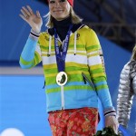 Women's super combined gold medalist Maria Hoefl-Riesch of Germany waves during the medals ceremony at the 2014 Winter Olympics, Monday, Feb. 10, 2014, in Sochi, Russia. (AP Photo/Morry Gash)
