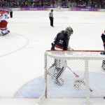 USA goaltender Jonathan Quick takes the puck out of the goal after Russia forward Pavel Datsyuk scored during the third period of a men's ice hockey game at the 2014 Winter Olympics, Saturday, Feb. 15, 2014, in Sochi, Russia. (AP Photo/Mark Humphrey)