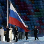 The flag of Russia is raised during the opening ceremony of the 2014 Winter Olympics in Sochi, Russia, Friday, Feb. 7, 2014. (AP Photo/Ivan Sekretarev)
