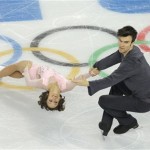 Meagan Duhamel and Eric Radford of Canada compete in the team pairs short program figure skating competition at the Iceberg Skating Palace during the 2014 Winter Olympics, Thursday, Feb. 6, 2014, in Sochi, Russia. (AP Photo/Vadim Ghirda)