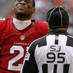 Arizona Cardinals cornerback Patrick Peterson (21) reacts to side judge James Coleman's (95) call during the first half of an NFL football game, Sunday, Dec. 23, 2012, in Glendale, Ariz. (AP Photo/Rick Scuteri)
