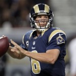 St. Louis Rams quarterback Sam Bradford throws during the first quarter of an NFL football game against the Arizona Cardinals, Sunday, Sept. 8, 2013, in St. Louis. (AP Photo/Tom Gannam)