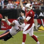 Arizona Cardinals quarterback Brian Hoyer (6) is pressured by Chicago Bears defensive end Israel Idonije (71) during the second half of an NFL football game, Sunday, Dec. 23, 2012, in Glendale, Ariz. (AP Photo/Rick Scuteri)
