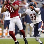 Arizona Cardinals wide receiver Larry Fitzgerald (11) pulls in a pass as Chicago Bears cornerback Charles Tillman (33) defends during the first half of an NFL football game, Sunday, Dec. 23, 2012, in Glendale, Ariz. (AP Photo/Paul Connors)