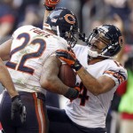 Chicago Bears running back Matt Forte (22) celebrates his touchdown with teammate Eric Weems (14) against the Arizona Cardinals during the first half of an NFL football game, Sunday, Dec. 23, 2012, in Glendale, Ariz. (AP Photo/Paul Connors)