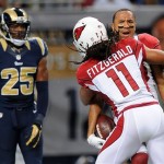 Arizona Cardinals wide receiver Michael Floyd is congratulated by teammate Larry Fitzgerald (11) after catching a 44-yard pass as St. Louis Rams safety T.J. McDonald, left, looks on during the second quarter of an NFL football game on Sunday, Sept. 8, 2013, in St. Louis. (AP Photo/L.G. Patterson)