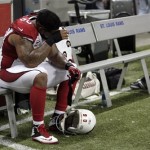 Arizona Cardinals defensive tackle Darnell Dockett sits on the bench following a 27-24 loss to the St. Louis Rams in an NFL football game on Sunday, Sept. 8, 2013, in St. Louis. (AP Photo/Tom Gannam)
