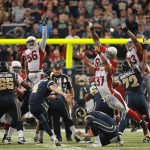 Arizona Cardinals players try to block St. Louis Rams kicker Greg Zuerlein's game-winning 48-yard field goal during the fourth quarter of an NFL football game, Sunday, Sept. 8, 2013 in St. Louis. (AP Photo/St. Louis Post-Dispatch, Chris Lee) 