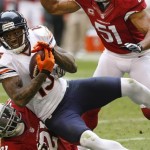Chicago Bears wide receiver Brandon Marshall (15) is tackled by Arizona Cardinals cornerback Patrick Peterson (21) during the first half of an NFL football game, Sunday, Dec. 23, 2012, in Glendale, Ariz. (AP Photo/Rick Scuteri)