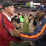 Arizona Cardinals coach Ken Whisenhunt, left, shakes hands with Chicago Bears coach Loie Smith, right, following an NFL football game,Sunday, Dec. 23, 2012, in Glendale, Ariz. The Bears won 28-13. (AP Photo/Paul Connors)
