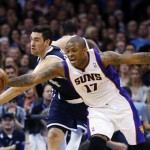 Oklahoma City Thunder forward Nick Collison, left, and Phoenix Suns forward P.J. Tucker (17) reach for the ball in the first quarter of an NBA basketball game in Oklahoma City, Monday, Dec. 31, 2012. (AP Photo/Sue Ogrocki)