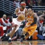Chicago Bulls guard Richard Hamilton, left, works against Phoenix Suns guard Shannon Brown during the first half of an NBA basketball game in Chicago on Saturday, Jan. 12, 2013. (AP Photo/Nam Y. Huh)