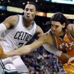 Boston Celtics forward Jared Sullinger (7) fights for control of a rebound with Phoenix Suns forward Luis Scola, right, during the second half of an NBA basketball game in Boston, Wednesday, Jan. 9, 2013. The Celtics won 87-79. (AP Photo/Elise Amendola)