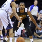 Phoenix Suns' Jerel McNeal, right, guards Utah Jazz's Bryce Cotton during the second half of an NBA summer league basketball game Tuesday, July 14, 2015, in Las Vegas. The Suns won 91-82. (AP Photo/Ronda Churchill)
