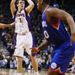 Phoenix Suns' Goran Dragic (1), of Slovenia, shoots in front of Philadelphia 76ers' Lavoy Allen during the second half in an NBA basketball game on Wednesday, Jan. 2, 2013, in Phoenix. The Suns defeated the 76ers 95-89. (AP Photo/Ross D. Franklin)