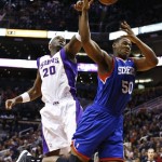 Phoenix Suns' Jermaine O'Neal (20) blocks the shot of Philadelphia 76ers' Lavoy Allen (50) during the first half of an NBA basketball game on Wednesday, Jan. 2, 2013, in Phoenix. (AP Photo/Ross D. Franklin)